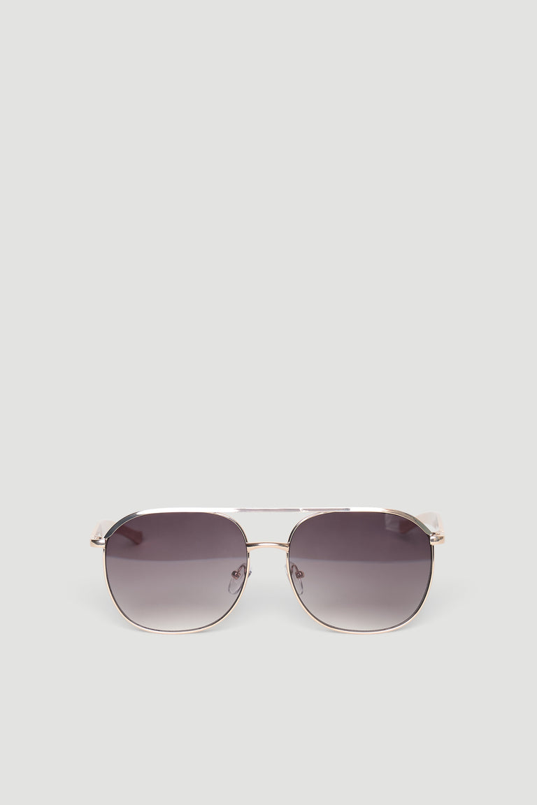 Sleek aviator sunglasses featuring gradient tinted lenses and a thin metallic frame in warm brown tones.
