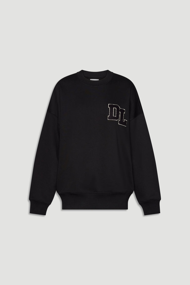 Black crew neck sweatshirt with long sleeves and subtle stitched logo detail on chest front.
