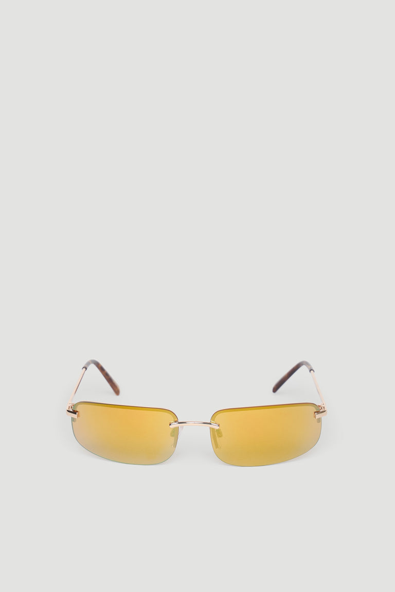 Slim gold metal frame sunglasses with amber tinted rectangular lenses and dark brown temple tips