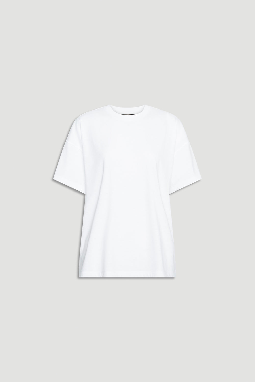 Relaxed fit white short sleeve tee with crew neckline offering a versatile and timeless casual wardrobe essential