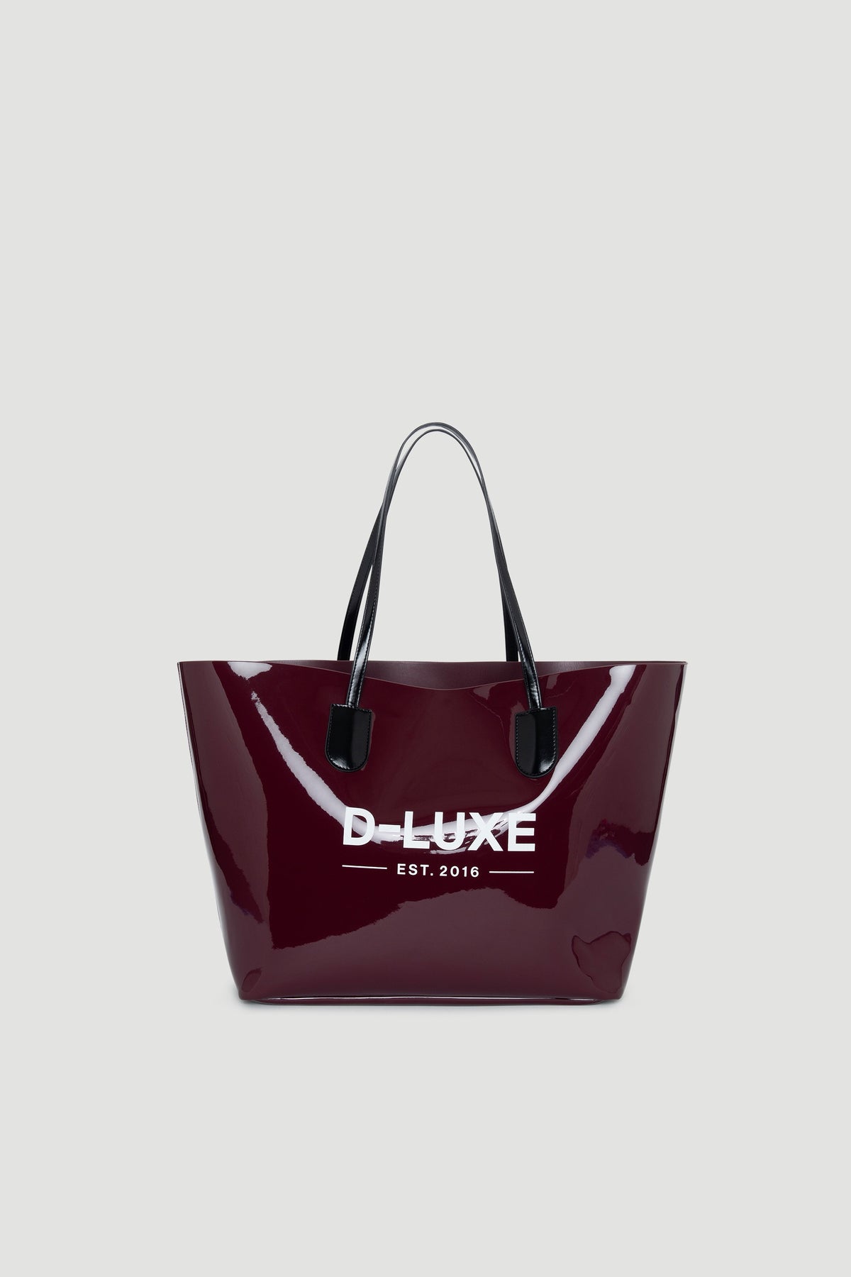 Glossy plum-colored tote bag with black handles and contrasting white branding on front panel.