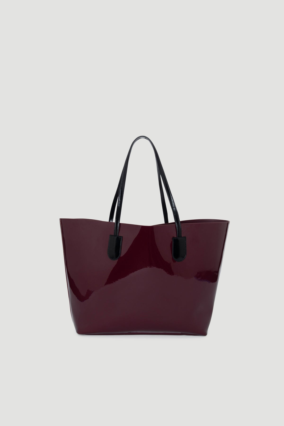 Glossy plum tote bag with black handles, featuring a sleek, structured silhouette for everyday style.