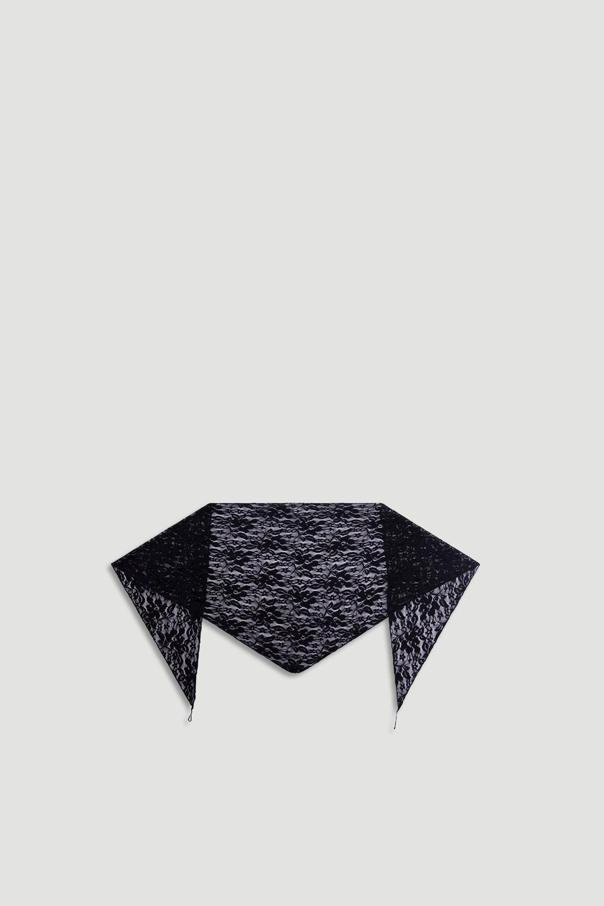 Penny Lace Scarf in black delicate lace fabric with intricate floral patterns, designed for versatile styling.