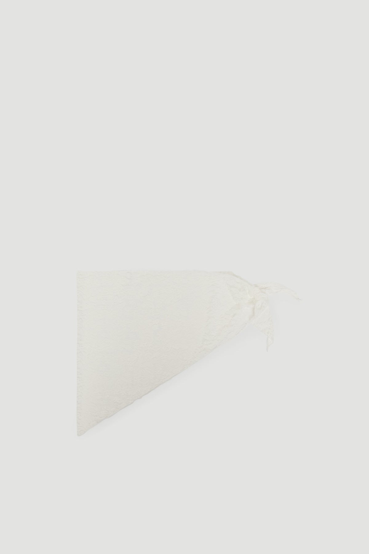 Soft white Penny Lace Scarf folded with delicate lace and fringe detailing by DECJUBA Australian fashion brand