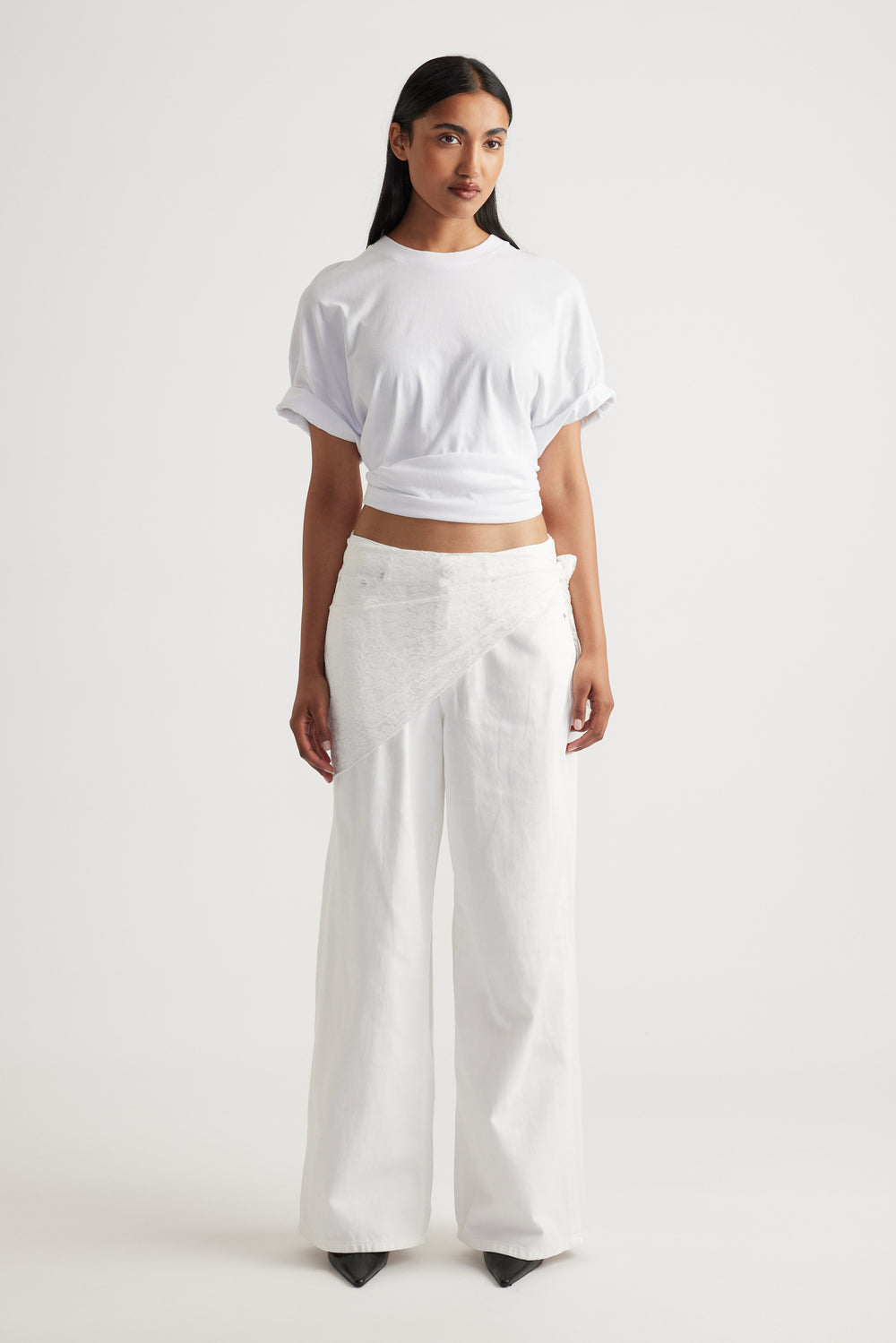 Woman styled in relaxed white tee paired with wide-leg pants featuring Penny Lace Scarf as a delicate, textured wrap accent.