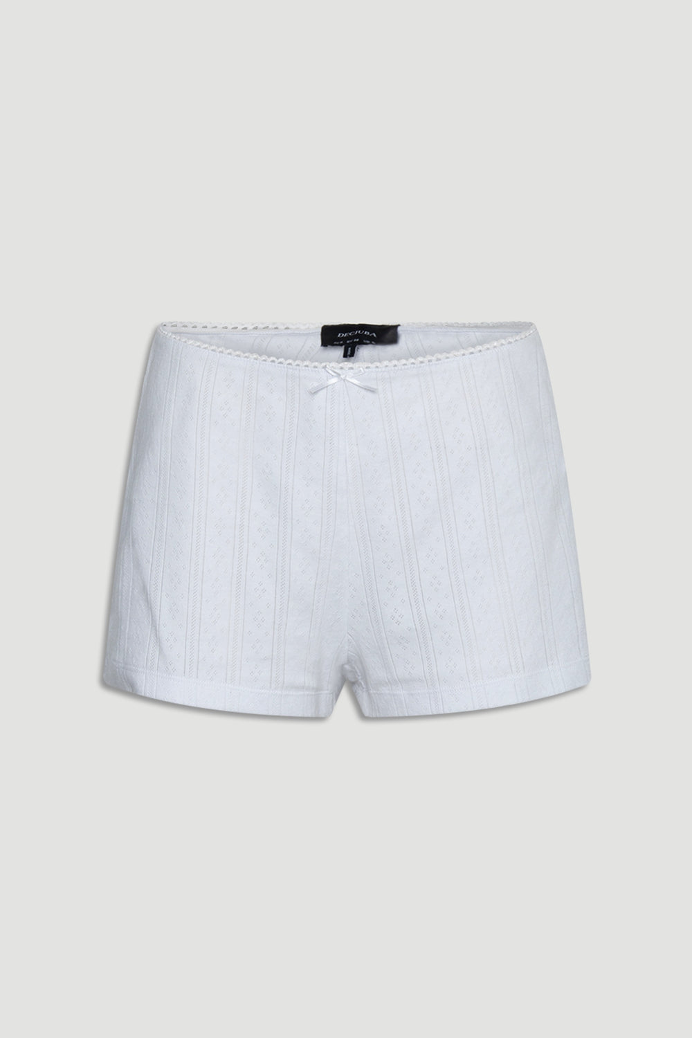 White textured pointelle shorts with delicate bow and soft knit fabric for comfortable loungewear fit