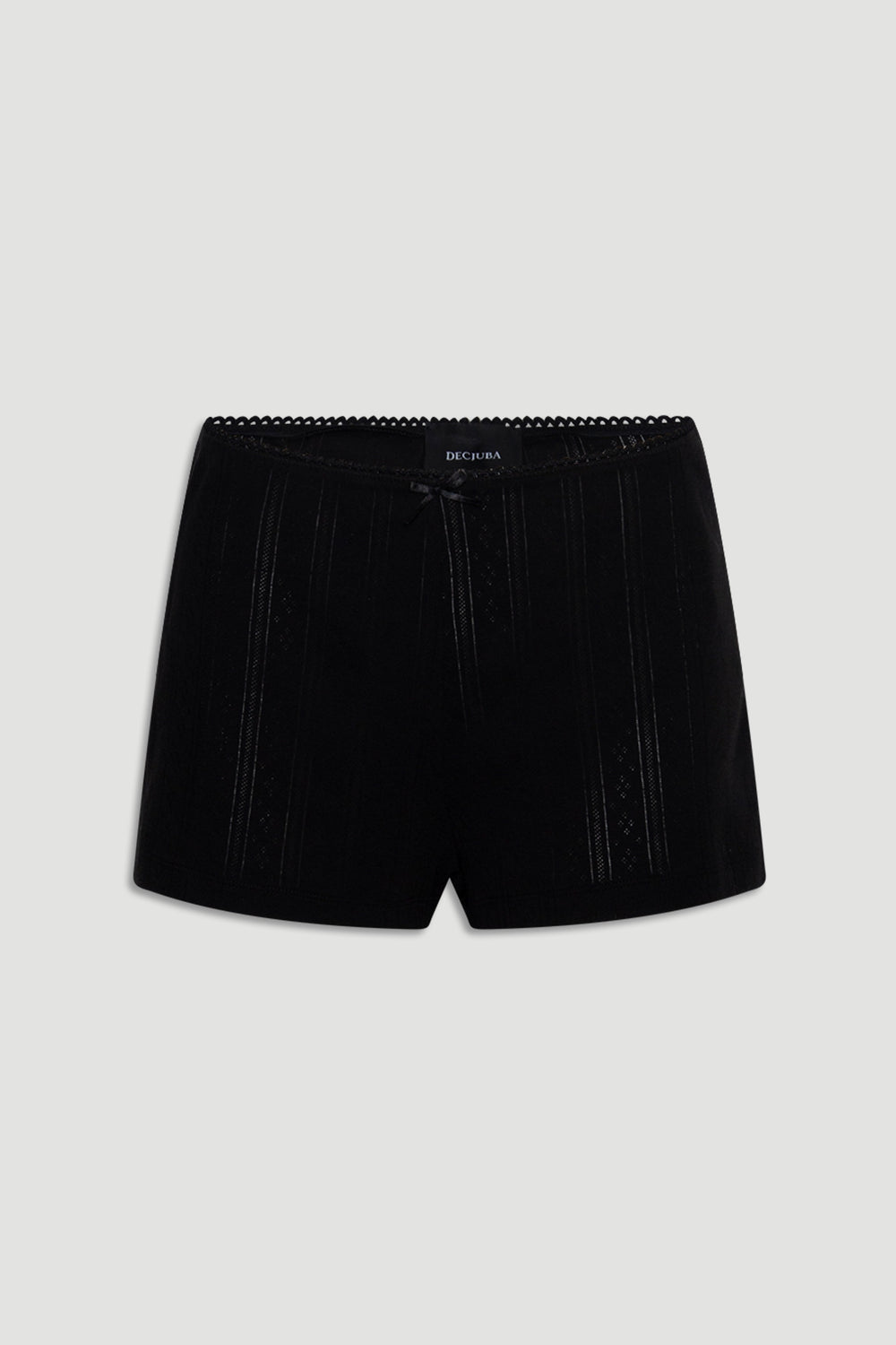 Black sleep shorts featuring delicate pointelle knit stripes, a small front bow, and scalloped waistband trim for a soft fit