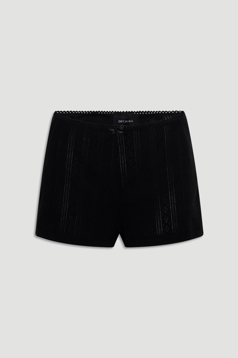 Black sleep shorts featuring delicate pointelle knit stripes, a small front bow, and scalloped waistband trim for a soft fit