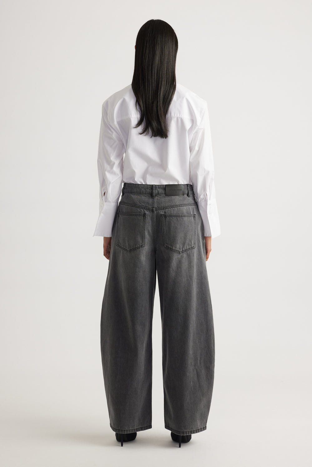 Daisy Horseshoe Jean in faded black denim with a high waist and relaxed wide leg by DECJUBA Australian fashion brand