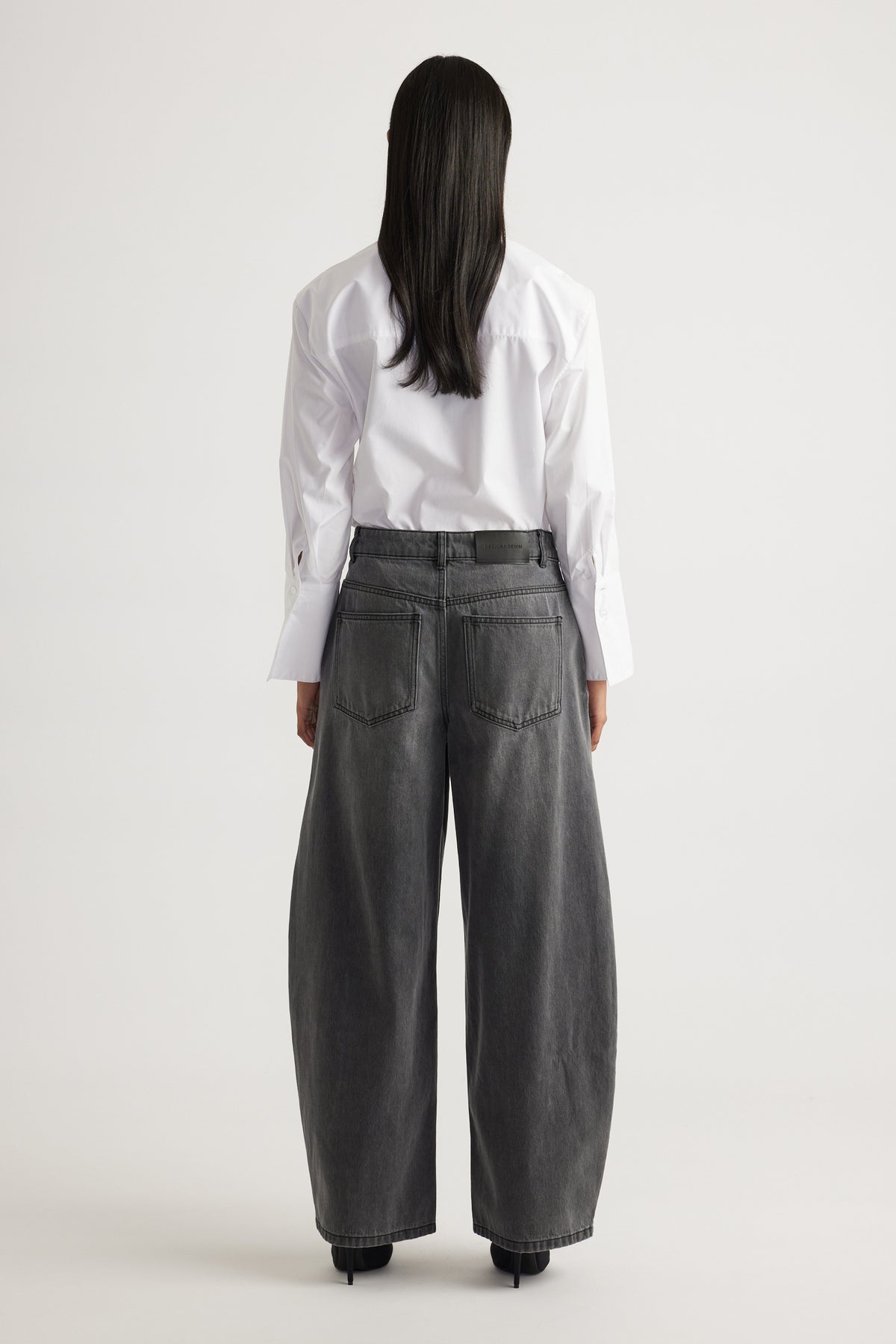 Daisy Horseshoe Jean in faded black denim with a high waist and relaxed wide leg by DECJUBA Australian fashion brand
