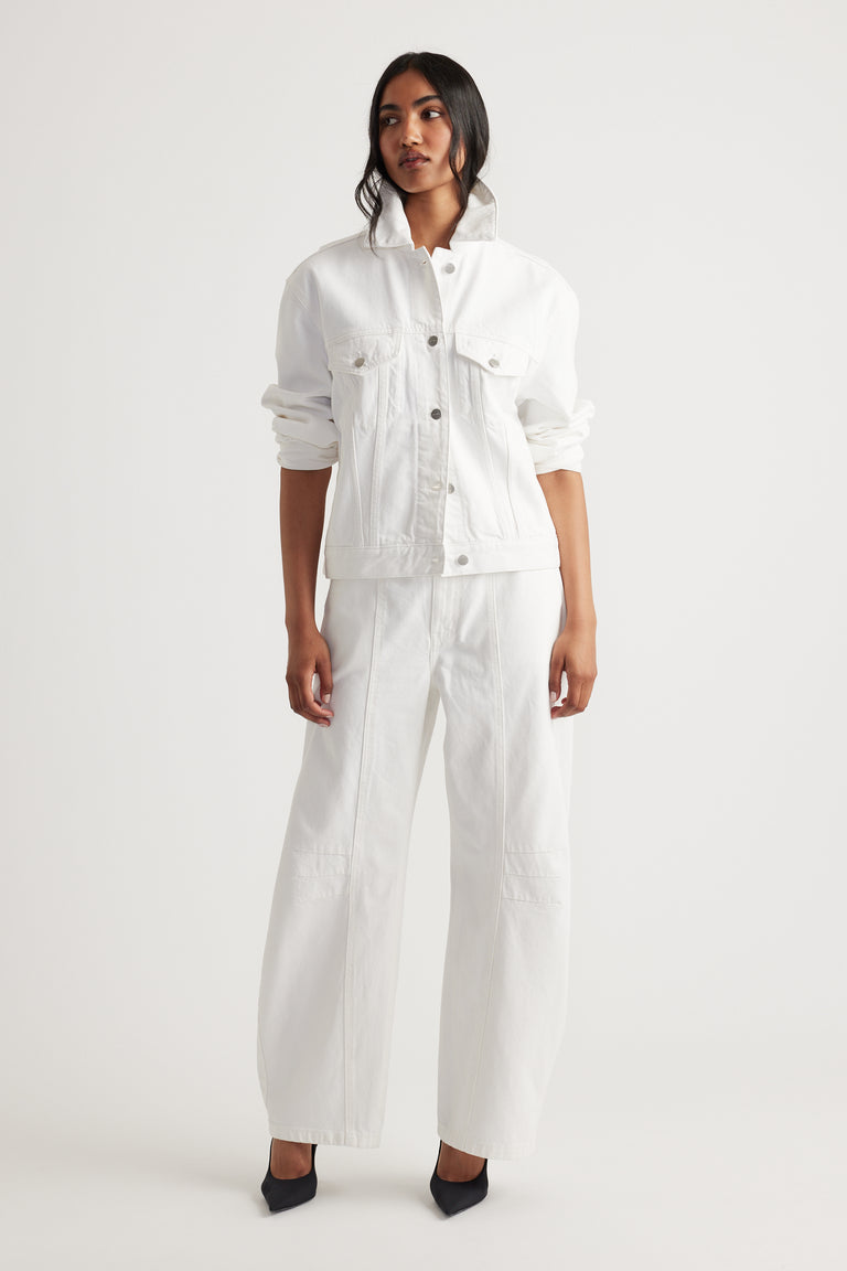 Nakita Denim Jacket in fresh white with structured collar and relaxed fit, paired with wide leg pants by DECJUBA Australian fashion brand