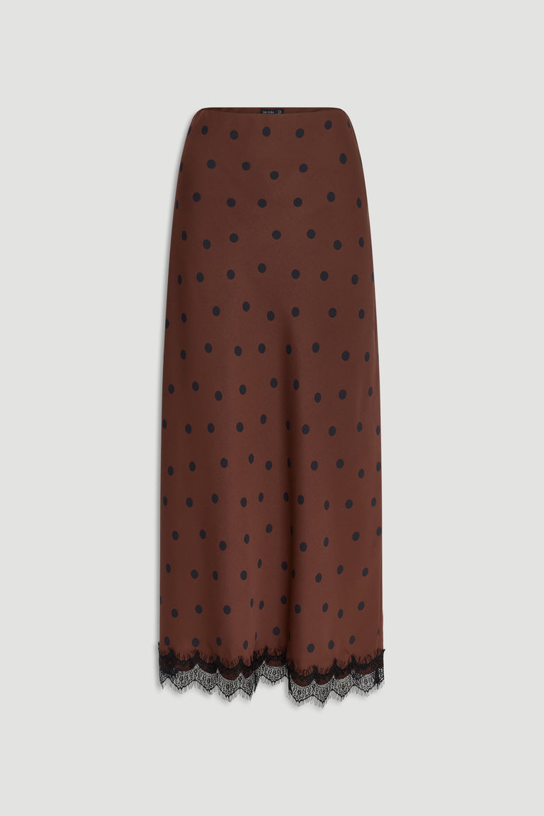 Brown maxi skirt with black polka dots and delicate lace trim along the hem for a refined finish