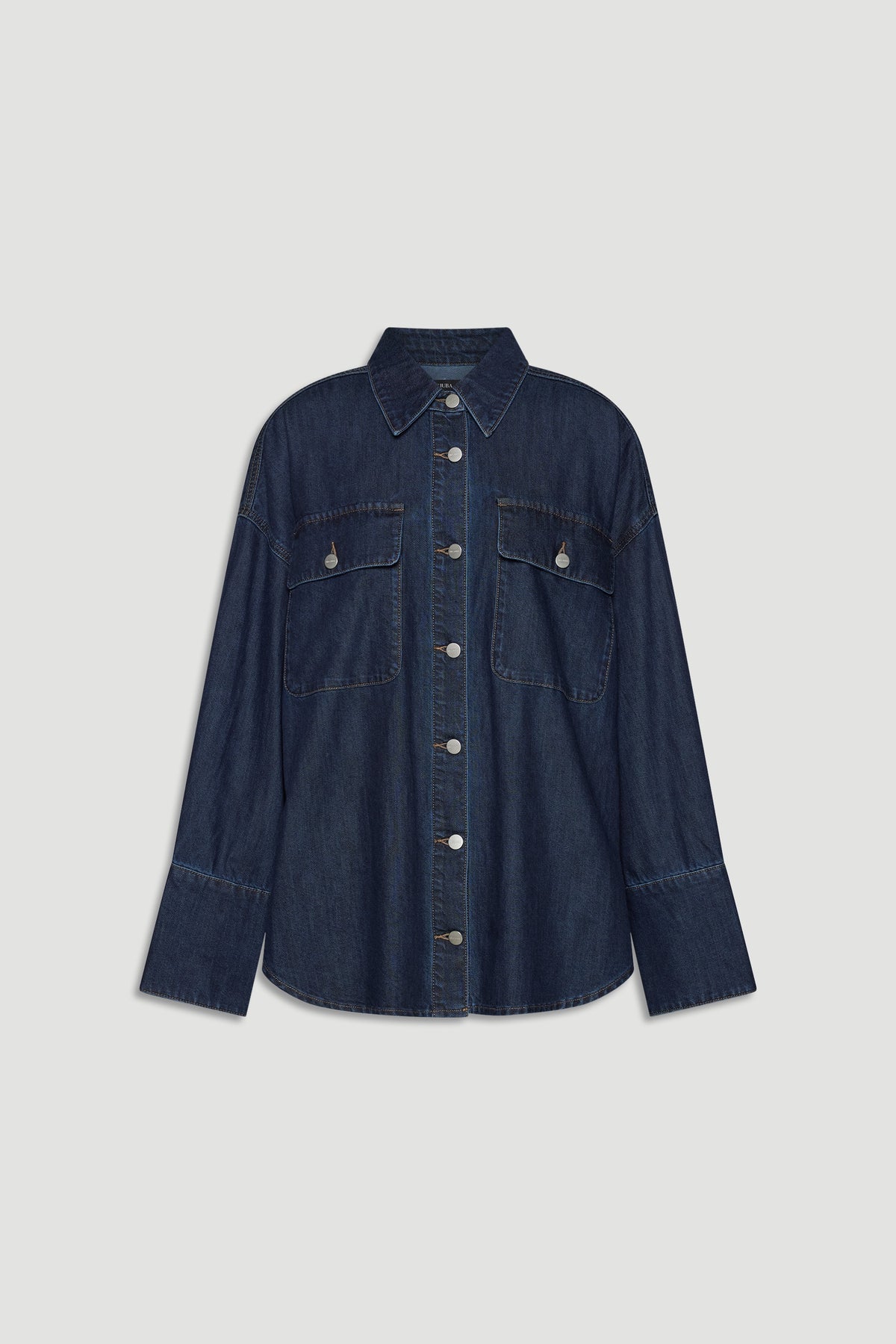 Dark indigo denim shirt with button front and chest flap pockets for a casual yet polished layering piece.