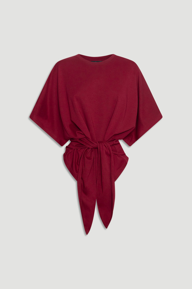 Soft knit deep red top with wide short sleeves and a front tie detail for a relaxed yet polished look