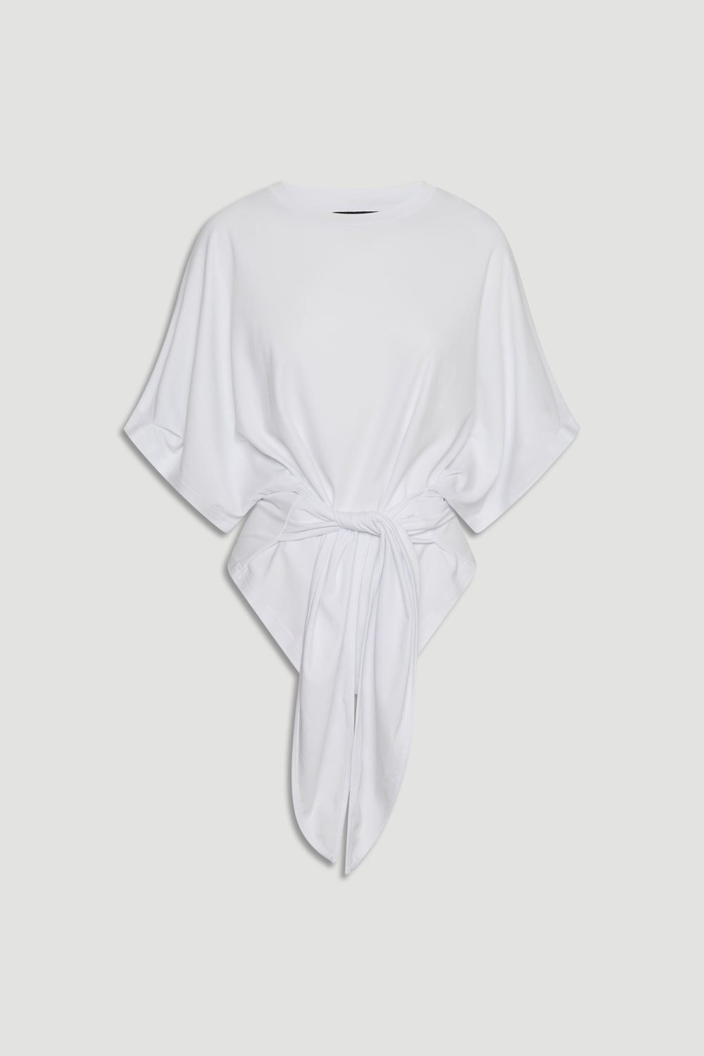 Front view of a loose white top with wide sleeves and a distinctive tie detail at the waist for a relaxed fit