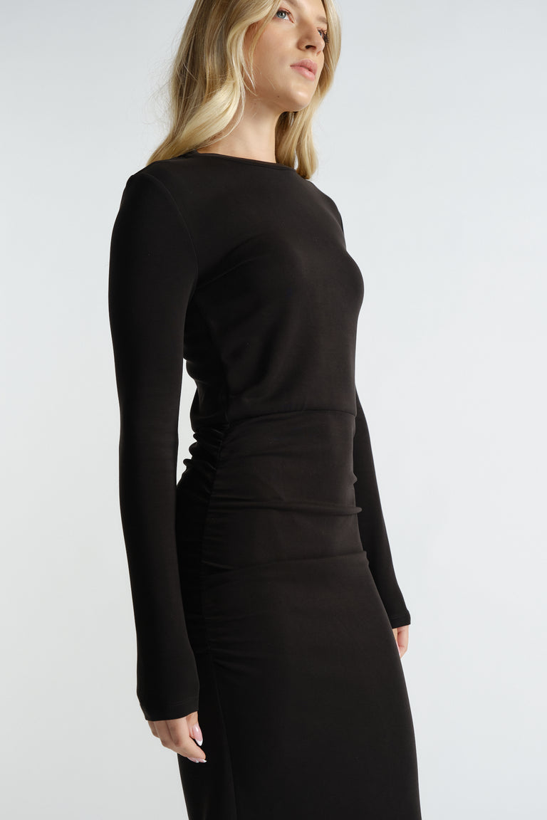 Black long-sleeve midi dress with a fitted silhouette and subtle ruching for a sleek, modern look.