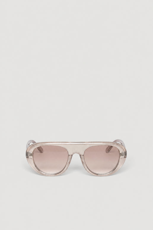 Oversized retro aviator sunglasses with a clear frame and tinted lenses