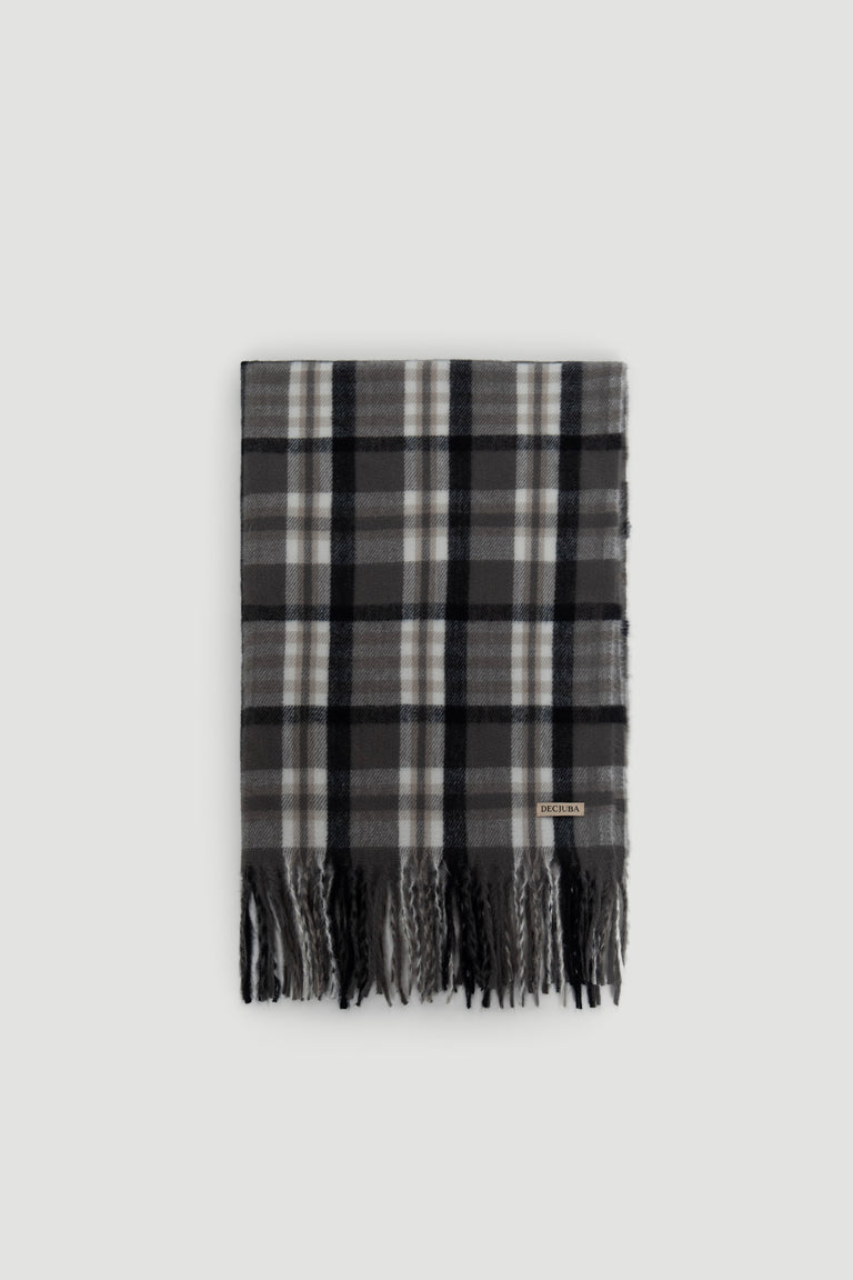 Folded grey and black checked scarf with soft texture and fringed edges on a light background