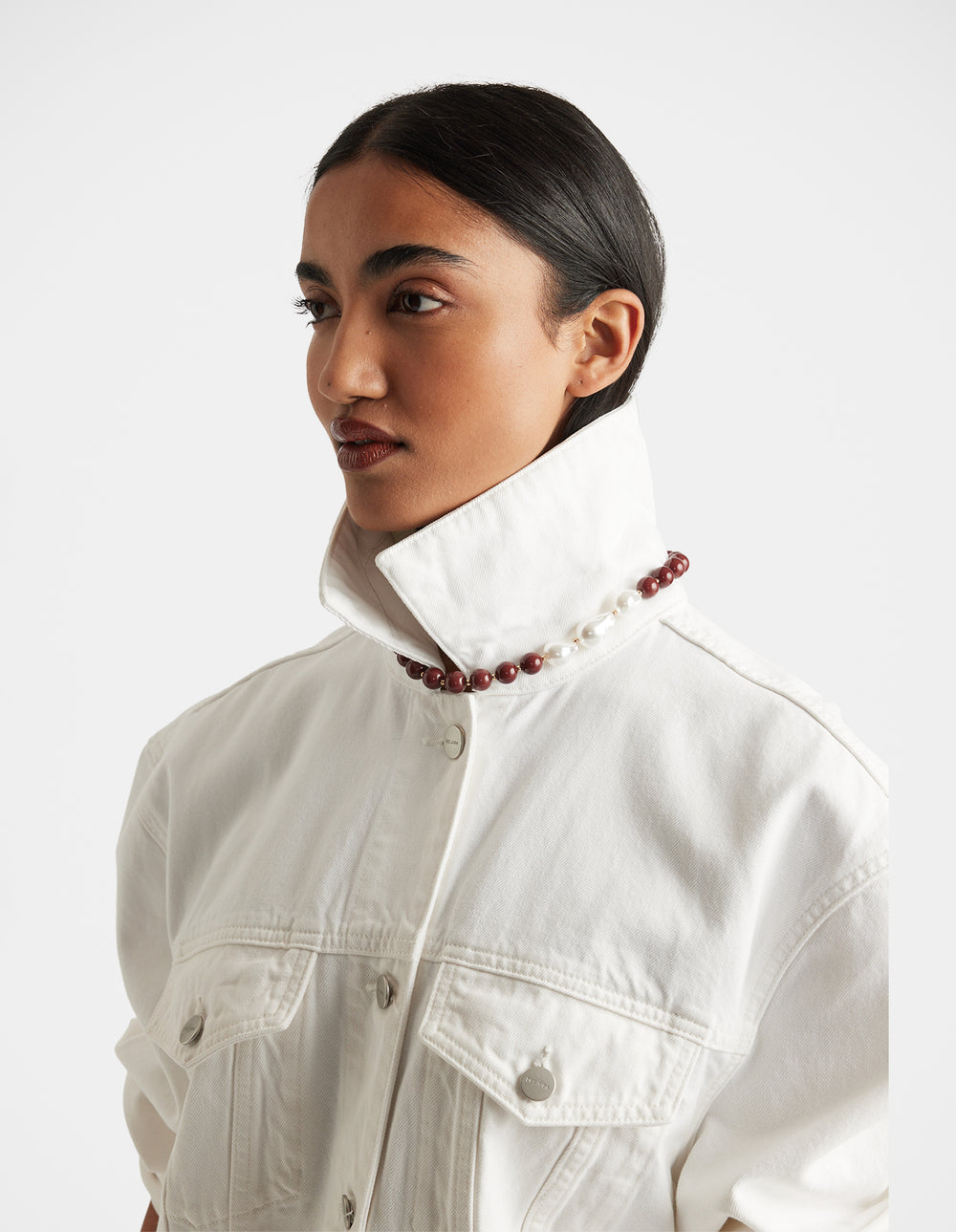 Woman wearing Mia Beaded Necklace with mixed acrylic and iron beads styled over high white collar by DECJUBA Australian fashion brand