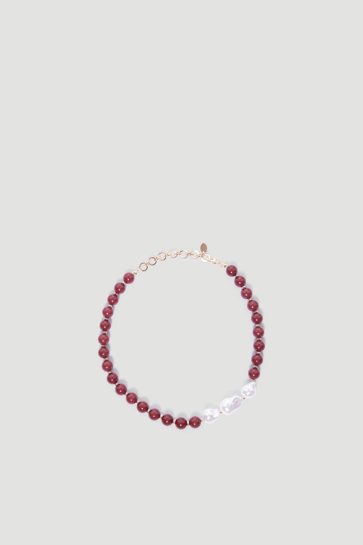 Mia Beaded Necklace featuring deep plum beads and irregular white pearls with a gold-tone adjustable clasp by DECJUBA.