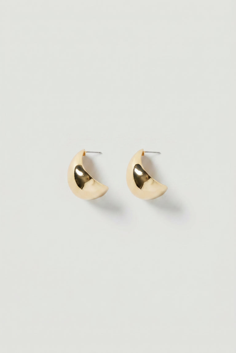 Pair of gold-toned crescent-shaped statement hoop earrings with a polished, reflective finish.