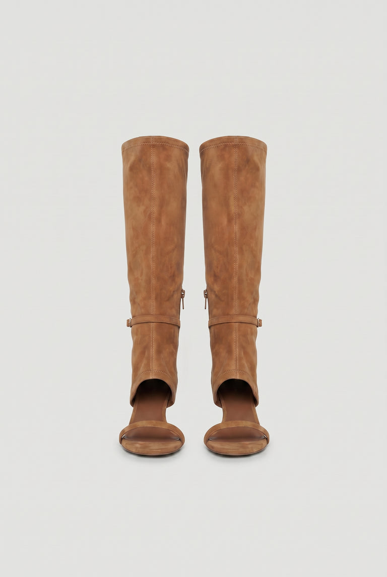 Pair of tan knee-high heels featuring an open toe and subtle buckle detail for a modern, stylish look.