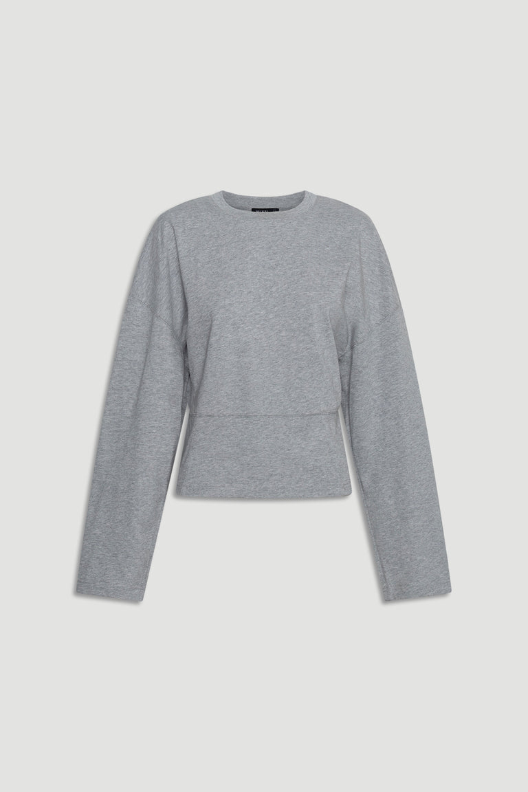 Soft grey long sleeve top with subtle seam detailing and a relaxed, slightly cropped fit for everyday wear