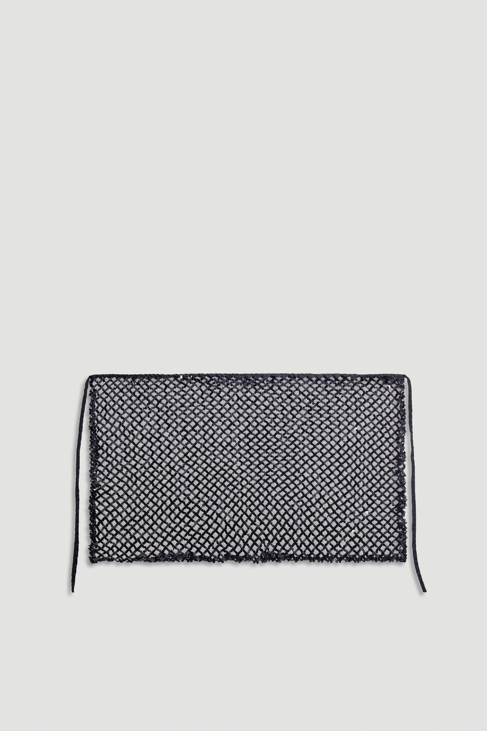 Yasmin Sequin Wrap in black with intricate sequin mesh fabric and tie closures for a chic, versatile layering accessory