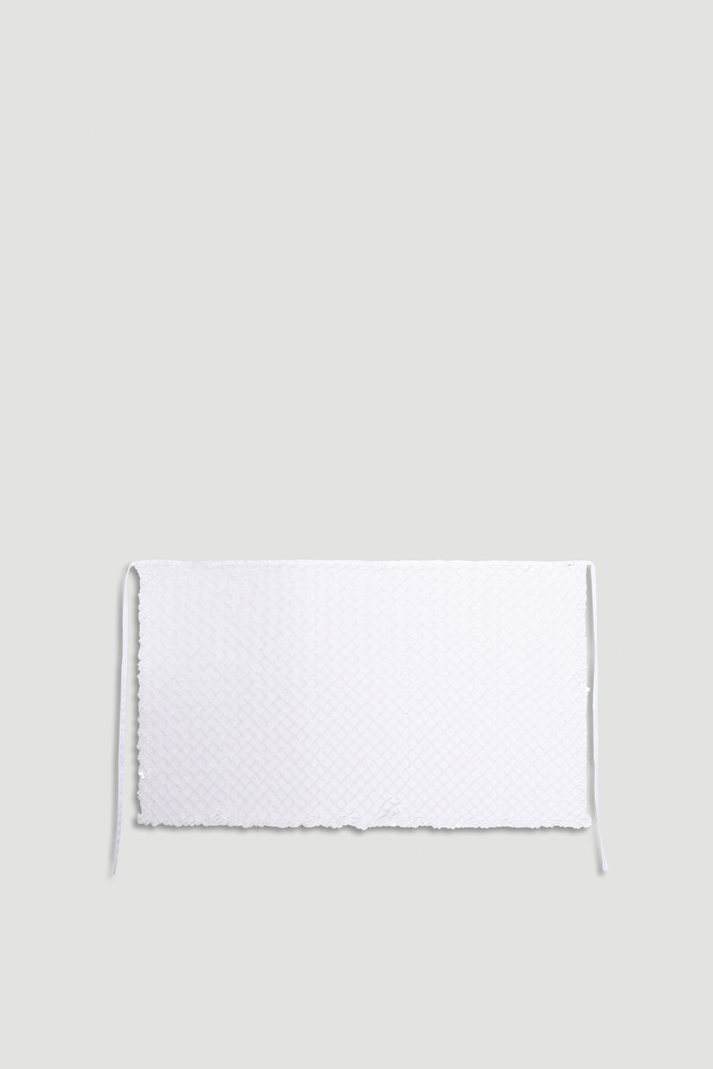 Yasmin Sequin Wrap in shimmering white with textured sparkle fabric and delicate tie closure for a stylish finish