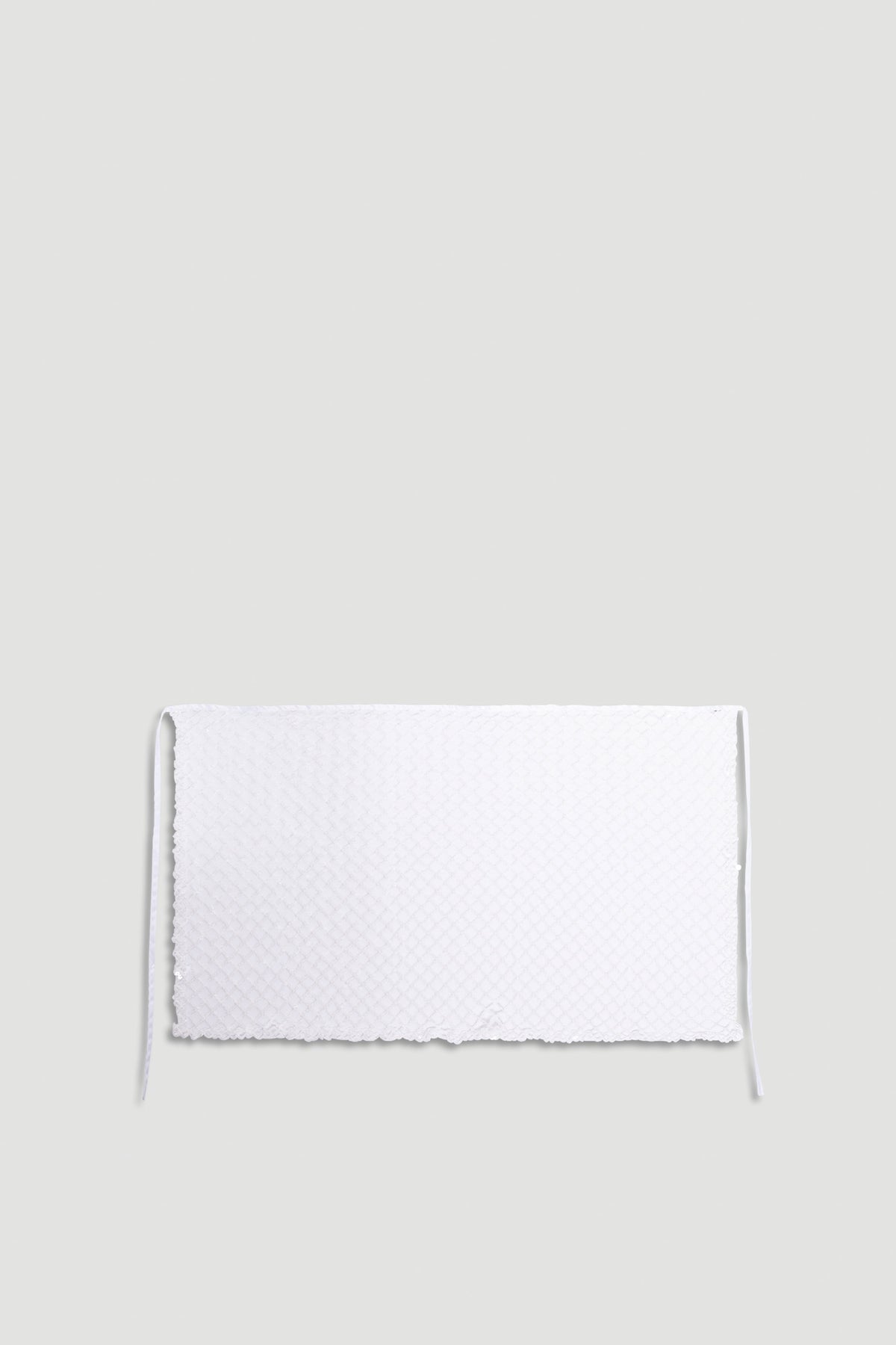 Yasmin Sequin Wrap in shimmering white with textured sparkle fabric and delicate tie closure for a stylish finish