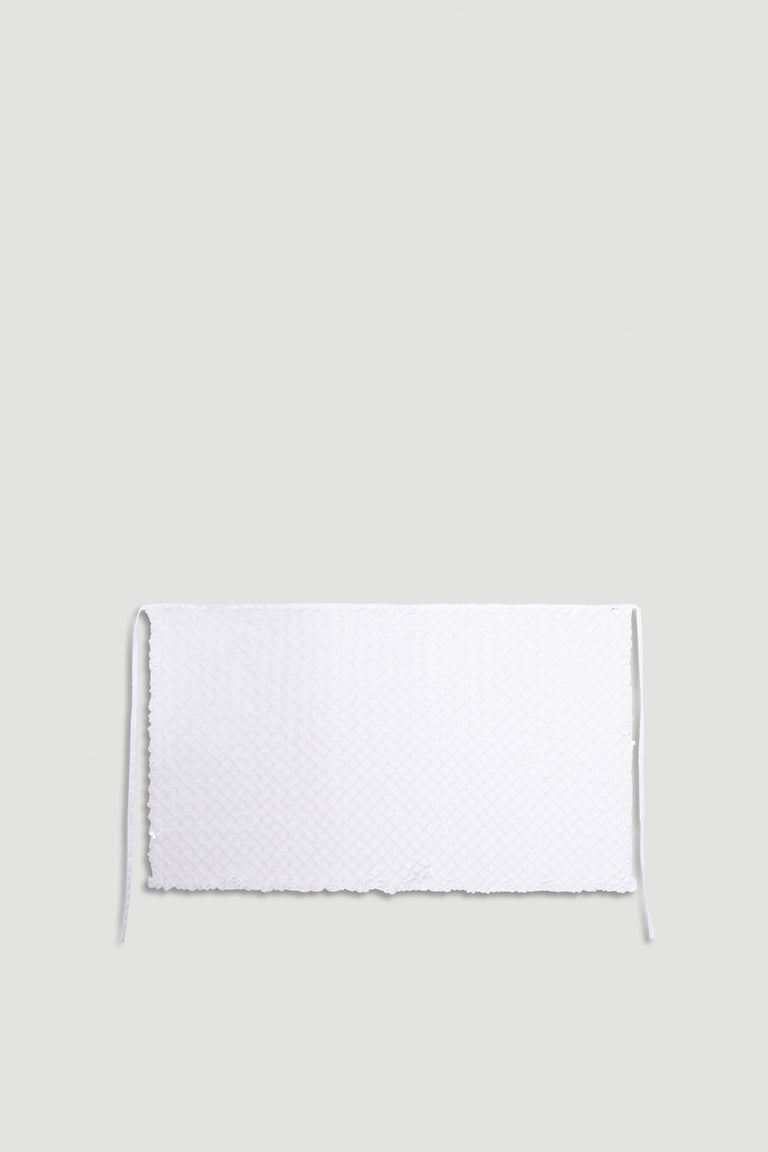 Yasmin Sequin Wrap in shimmering white with textured sparkle fabric and delicate tie closure for a stylish finish