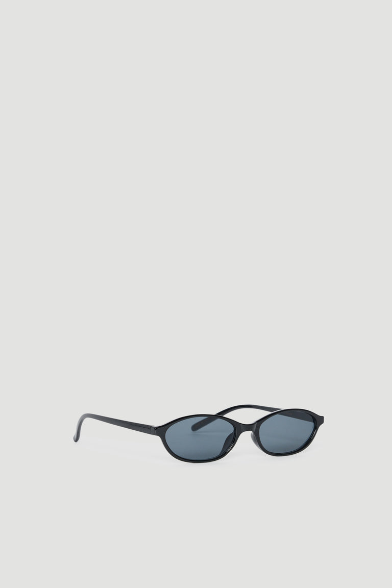 Slim black cat eye sunglasses with tinted lenses offering 100% UV protection in a sleek, minimalist design.