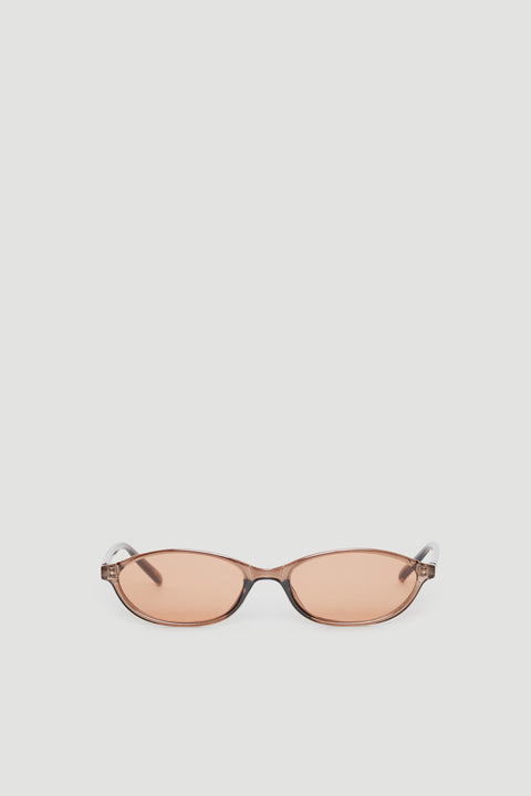 Slim cat eye sunglasses with tinted lenses offering 100% UV protection in a sleek, modern frame design.