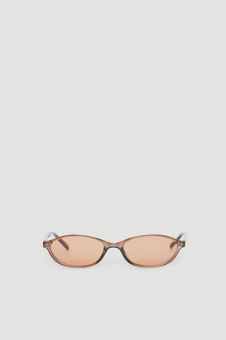 Slim cat eye sunglasses with tinted lenses offering 100% UV protection in a sleek, modern frame design.