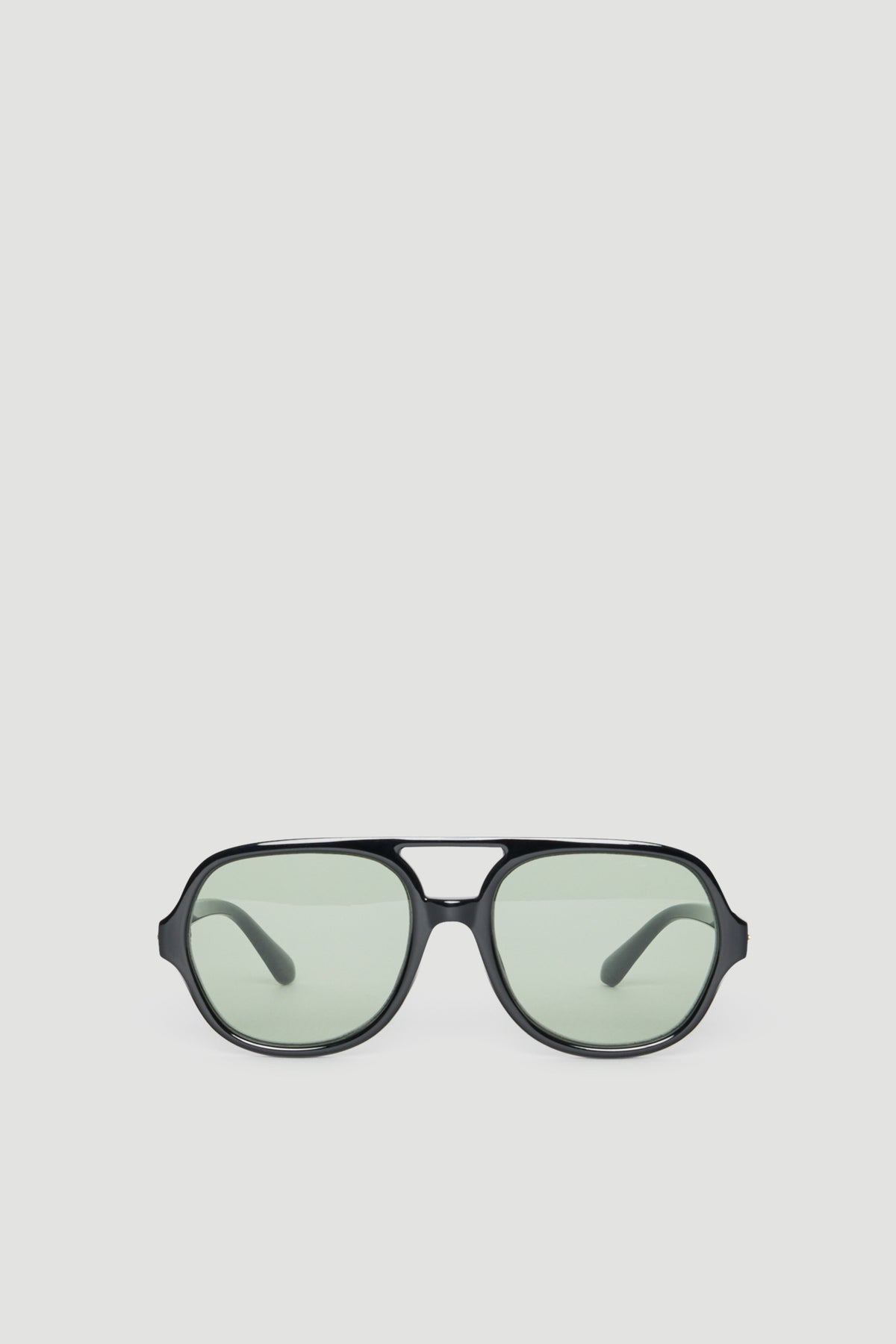 Oversized aviator sunglasses with black frames and lightly tinted lenses offering full UV protection