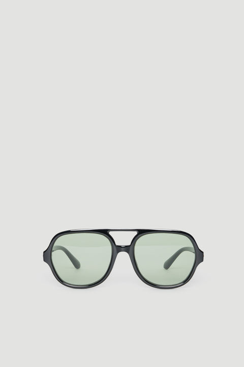 Oversized aviator sunglasses with black frames and lightly tinted lenses offering full UV protection