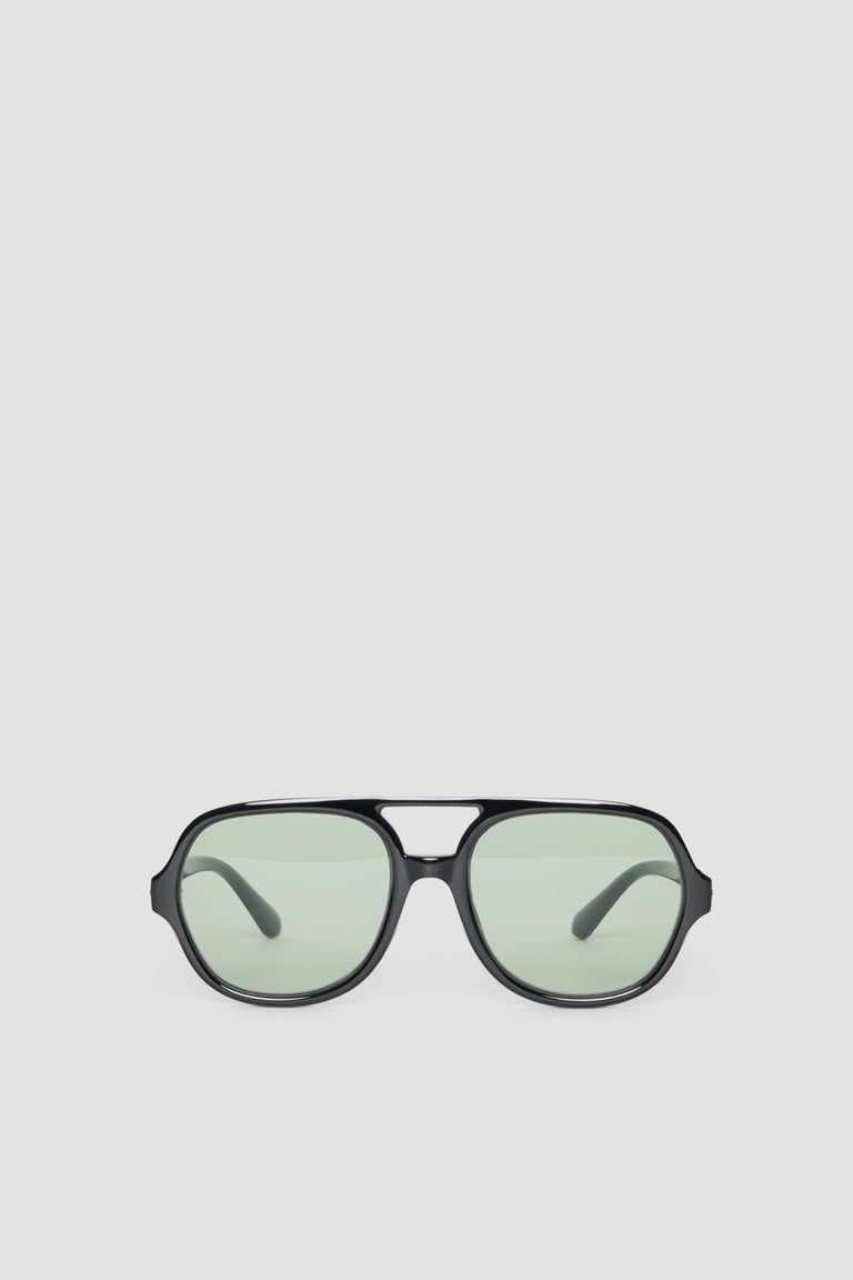 Oversized aviator sunglasses with black frames and lightly tinted lenses offering full UV protection