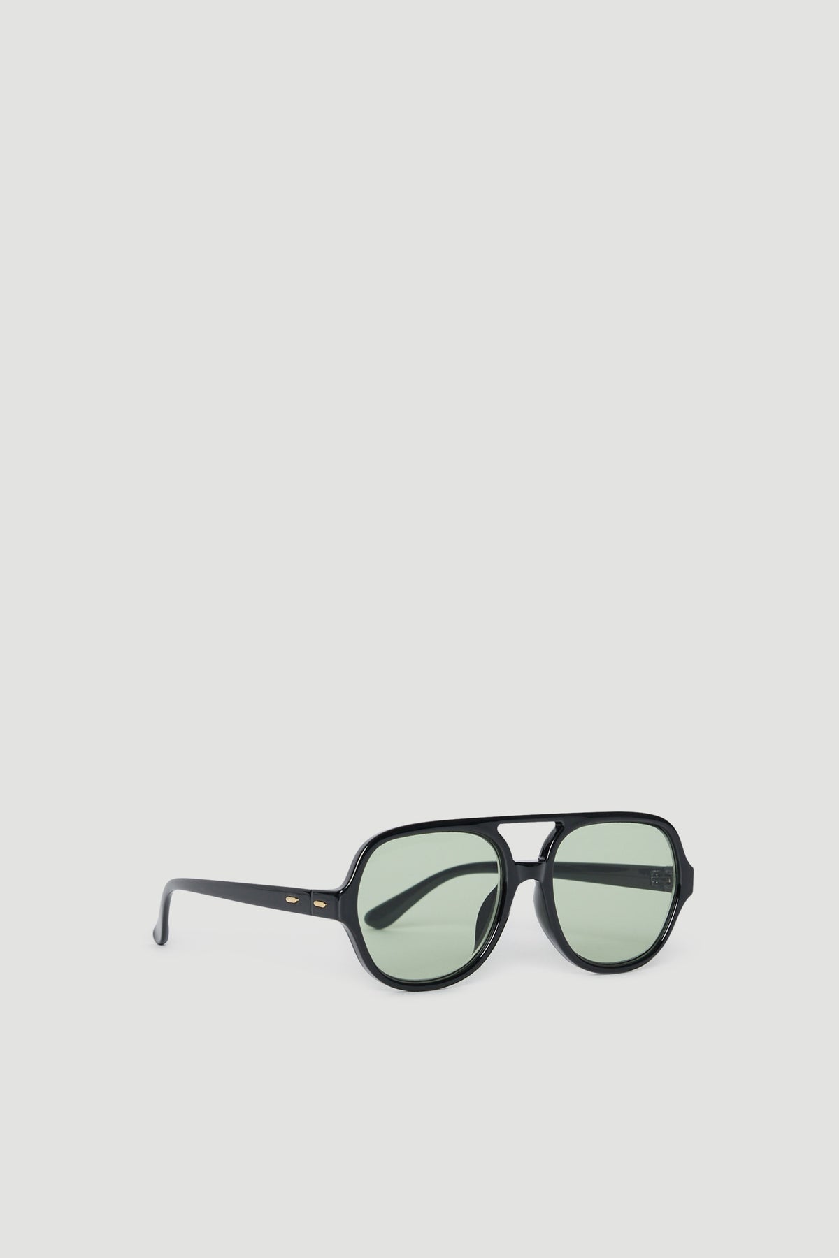Oversized black aviator sunglasses with tinted lenses and slim arms, offering full UV protection and modern style.