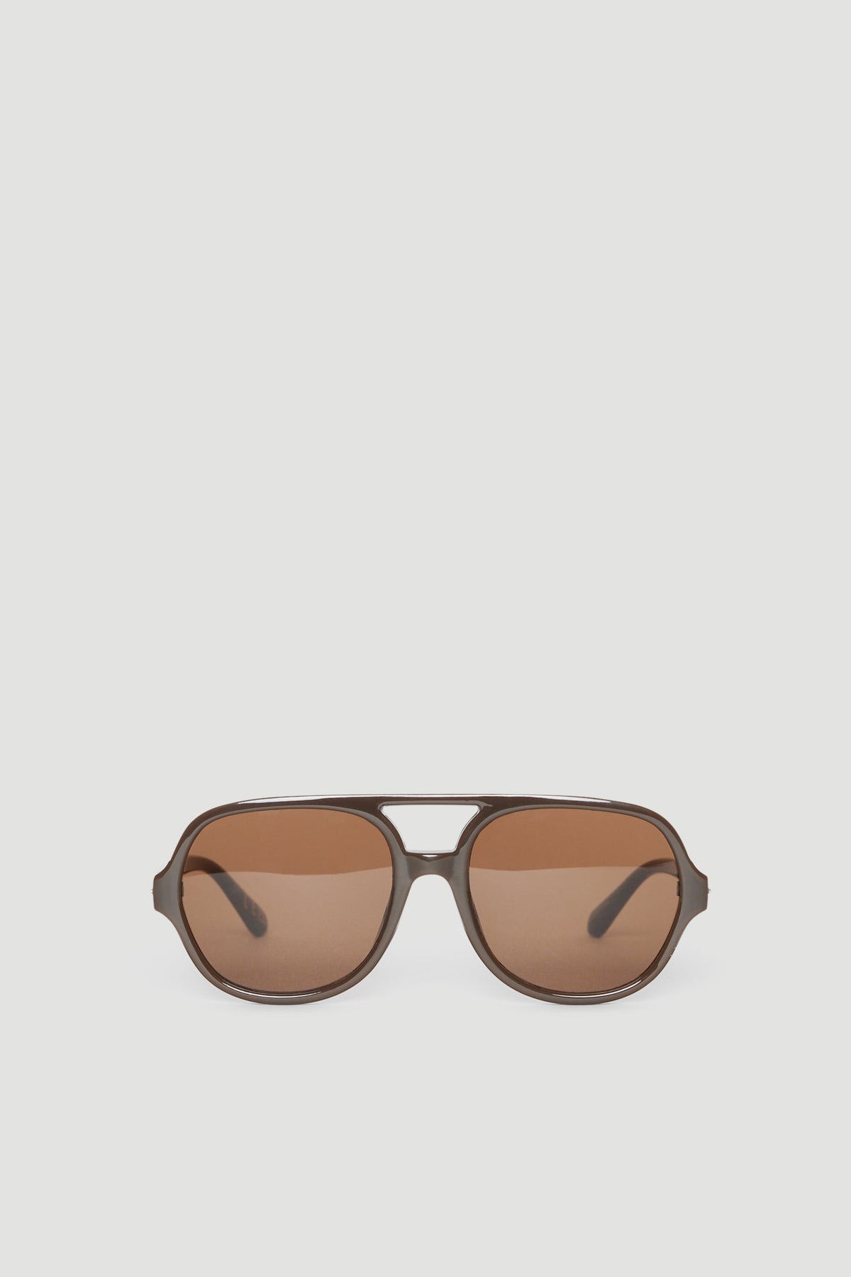 Oversized aviator sunglasses with brown tinted lenses and a matte brown frame offering full UV protection
