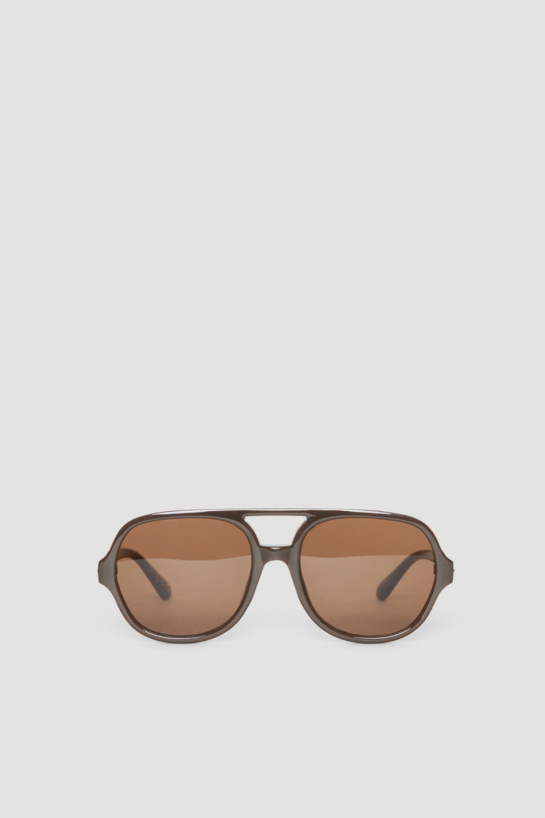 Oversized aviator sunglasses with brown tinted lenses and a matte brown frame offering full UV protection