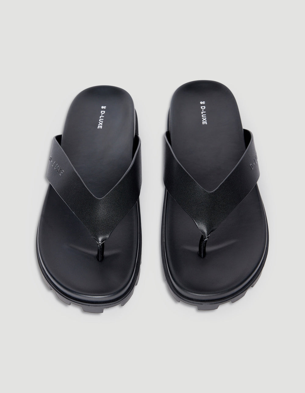 Pair of black chunky platform thong sandals with slip-on design and textured anti-slip sole viewed from above
