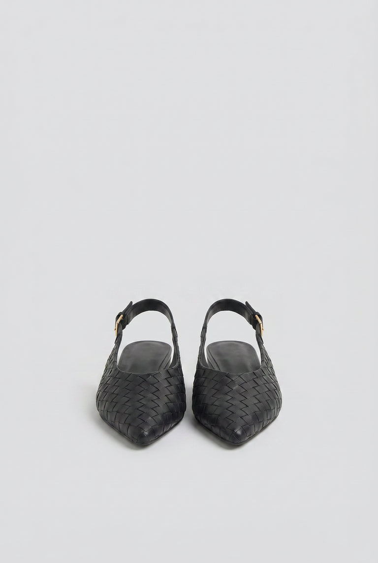 Pair of black slingback flats with a woven leather design and adjustable gold buckle straps.