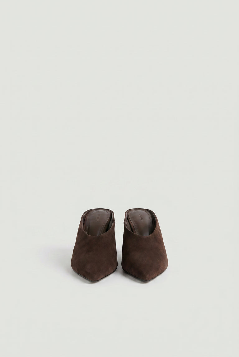 Pair of brown pointed-toe slip-on heels in a soft, matte finish against a light neutral background.