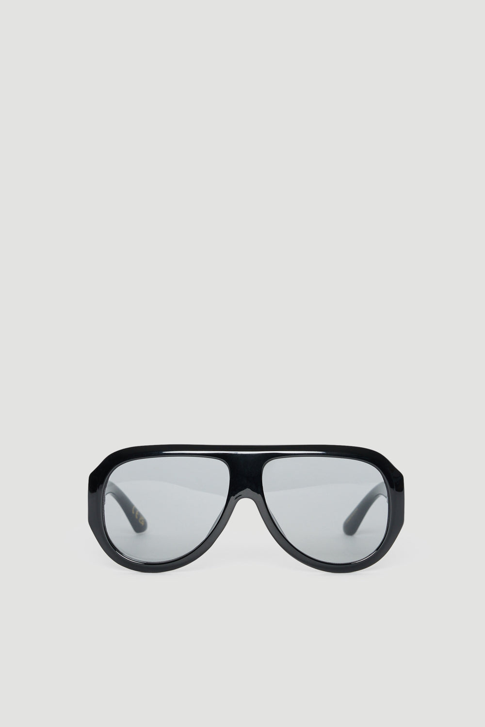 Oversized black aviator sunglasses with tinted lenses offering full UV protection on a light background