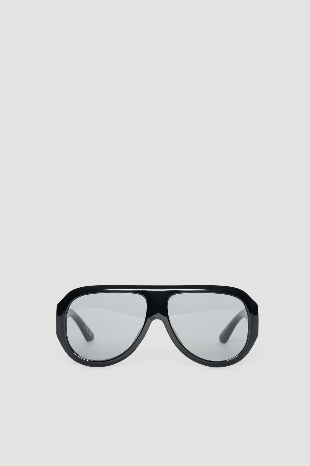Oversized black aviator sunglasses with tinted lenses offering full UV protection on a light background