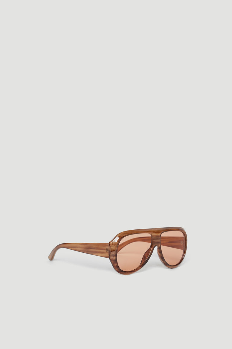 Brown oversized aviator sunglasses with tinted lenses offering full UV protection on a plain background