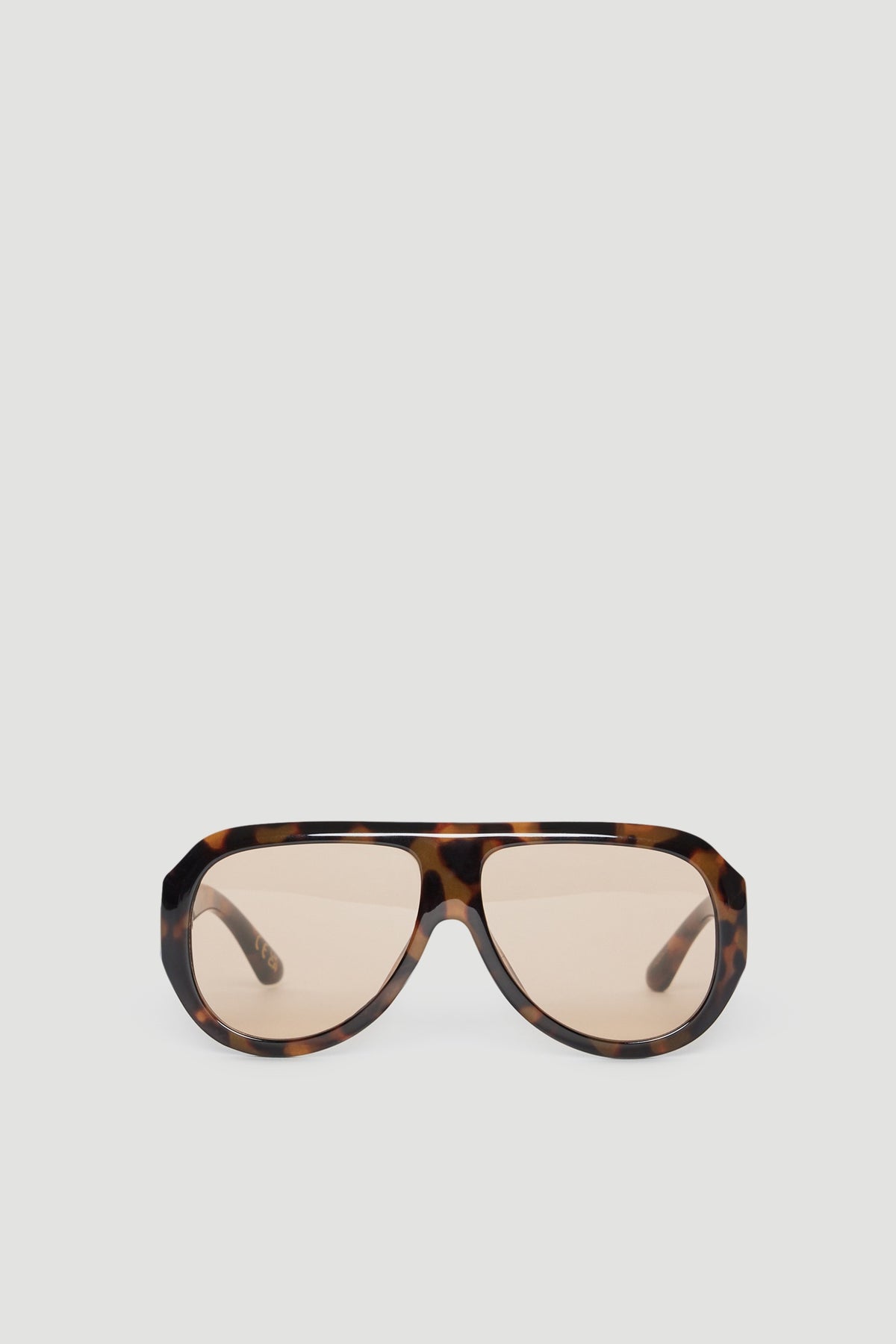 Oversized aviator sunglasses with a tortoiseshell frame and tinted lenses offering full UV protection