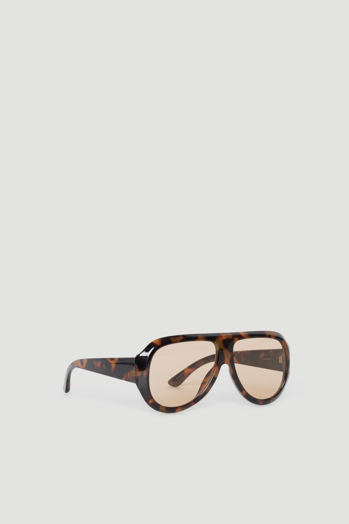 Oversized aviator sunglasses with tortoiseshell frame and tinted lenses offering full UV protection