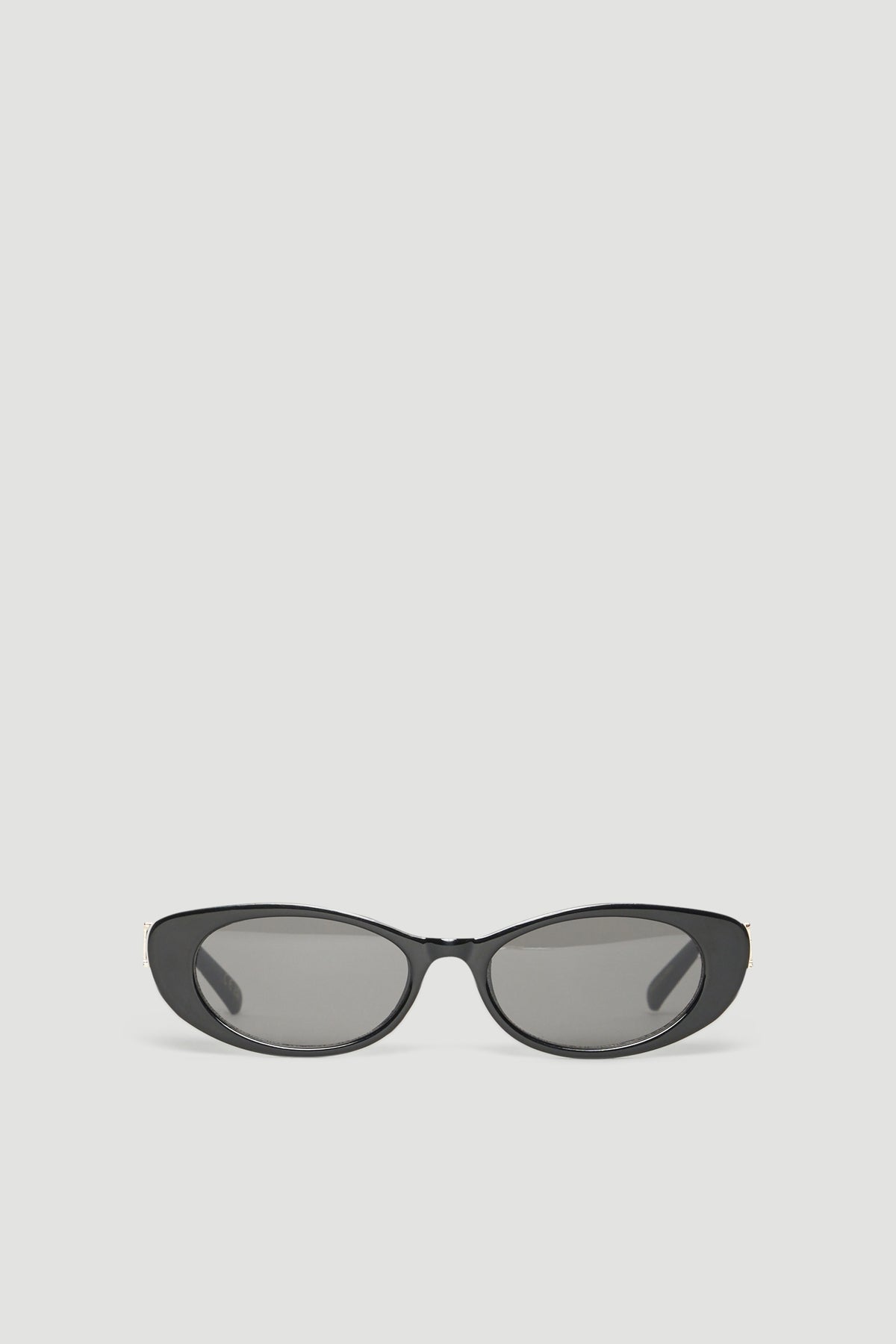 Oval black sunglasses with dark grey lenses and a slim curved frame
