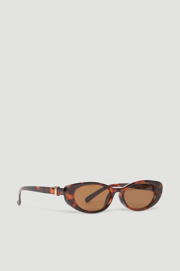 Tortoiseshell oval sunglasses with gold accents and brown tinted lenses